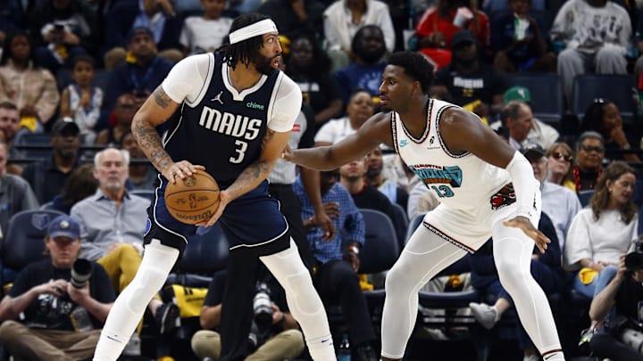 Dallas Mavericks forward Anthony Davis handles the ball against Memphis Grizzlies forward Jaren Jackson Jr.
