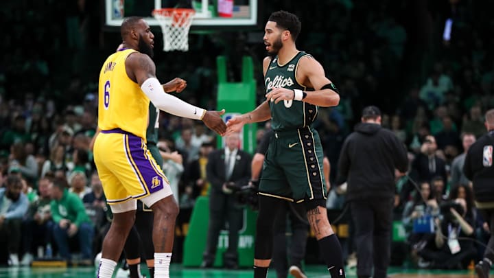 Jan 28, 2023; Boston, Massachusetts, USA; Boston Celtics forward Jayson Tatum (0) and Los Angeles Lakers forward LeBron James (6) react before playing at TD Garden. Mandatory Credit: Paul Rutherford-Imagn Images