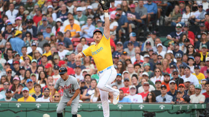 Sep 27, 2025; Boston, Massachusetts, USA; Boston Red Sox first baseman Nathaniel Lowe (37) stretches for the ball for an out during the fourth inning against the Detroit Tigers at Fenway Park. Mandatory Credit: Bob DeChiara-Imagn Images