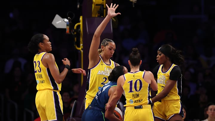 May 18, 2025; Los Angeles, California, USA;  (From left to right) Los Angeles Sparks forward Azura Stevens (23) and center Mercedes Russell (21) and guard Kelsey Plum (10) and forward Rickea Jackson (2) defend Minnesota Lynx forward Napheesa Collier (24) during the second half at Crypto.com Arena. Mandatory Credit: Kiyoshi Mio-Imagn Images