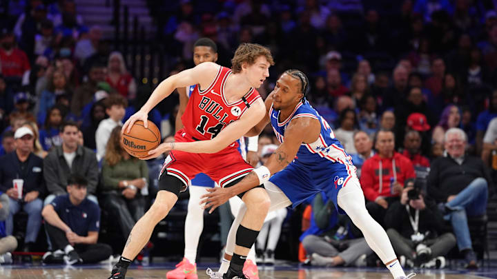 Apr 13, 2025; Philadelphia, Pennsylvania, USA; Chicago Bulls forward Matas Buzelis (14) controls the ball against Philadelphia 76ers forward Marcus Bagley (35) in the first quarter at Wells Fargo Center. Mandatory Credit: Kyle Ross-Imagn Images