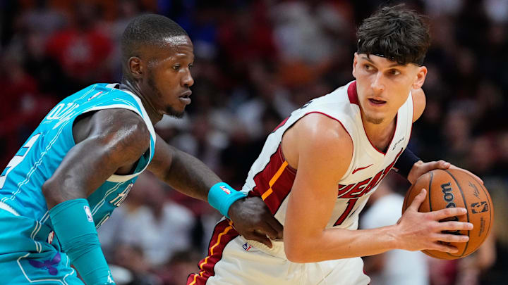 Oct 10, 2023; Miami, Florida, USA; Miami Heat guard Tyler Herro (14) looks to dribble past Charlotte