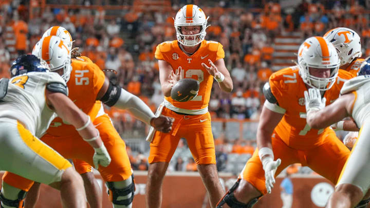 Tennessee quarterback Jake Merklinger (12) catches the ball after a snap during a NCAA game between Tennessee and Kent State in Neyland Stadium in Knoxville on Saturday, Sept. 14, 2024.