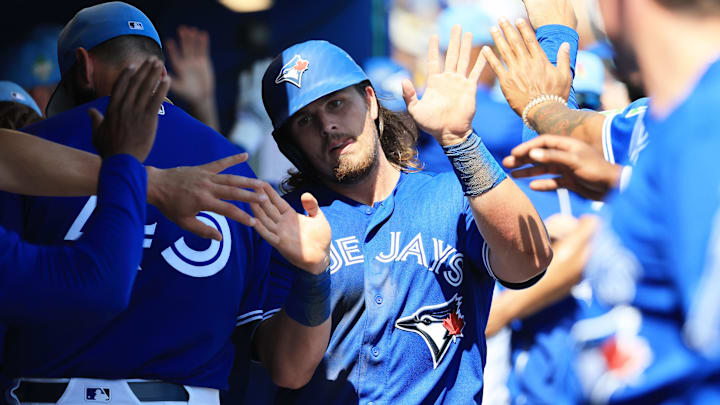 Mar 10, 2026; Dunedin, Florida, USA;  Toronto Blue Jays third baseman Addison Barger (47) celebrates after scoring during the fourth inning against the Atlanta Braves at TD Ballpark. Mandatory Credit: Kim Klement Neitzel-Imagn Images