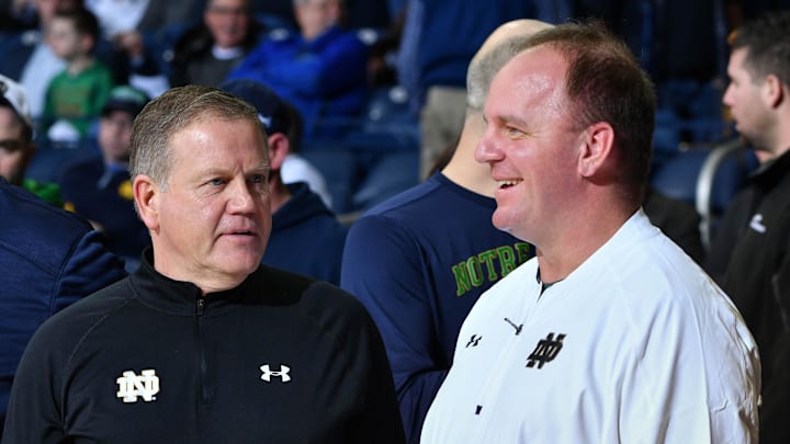 Feb 7, 2017; South Bend, IN, USA; Notre Dame Fighting Irish head football coach Brian Kelly and his defensive coordinator Mike Elko watch warmups before the game between the Notre Dame Fighting Irish and the Wake Forest Demon Deacons at the Purcell Pavilion. Mandatory Credit: Matt Cashore-Imagn Images Feb 7, 2017; South Bend, IN, USA; Notre Dame Fighting Irish head football coach Brian Kelly and his defensive coordinator Mike Elko watch warmups before the game between the Notre Dame Fighting Irish and the Wake Forest Demon Deacons at the Purcell Pavilion. Mandatory Credit: Matt Cashore-Imagn Images