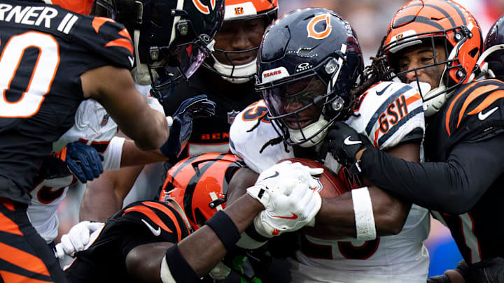 Cincinnati Bengals safety Jordan Battle (27) and Cincinnati Bengals safety Geno Stone (22) tackles Chicago Bears running back Kyle Monangai (25) in the second quarter of the NFL football game between Chicago Bears and Cincinnati Bengals at Paycor Stadium in Cincinnati on Nov. 2, 2025.