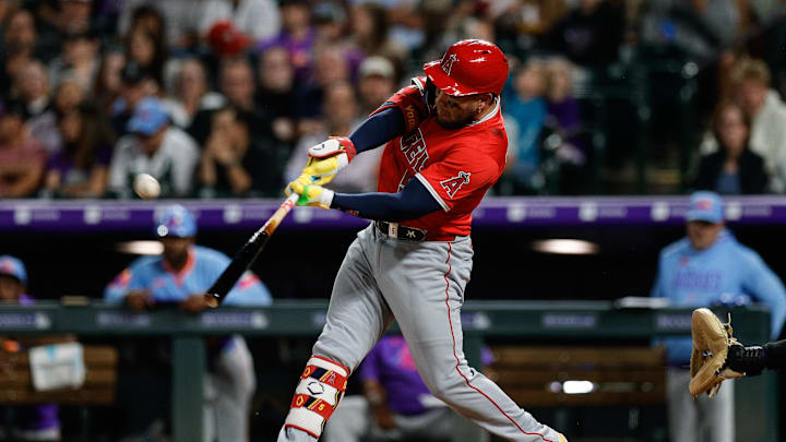 Sep 19, 2025; Denver, Colorado, USA; Los Angeles Angels third baseman Yoan Moncada (5) hits a sacrifice fly RBI in the fifth inning against the Colorado Rockies at Coors Field. Mandatory Credit: Isaiah J. Downing-Imagn Images Sep 19, 2025; Denver, Colorado, USA; Los Angeles Angels third baseman Yoan Moncada (5) hits a sacrifice fly RBI in the fifth inning against the Colorado Rockies at Coors Field. Mandatory Credit: Isaiah J. Downing-Imagn Images
