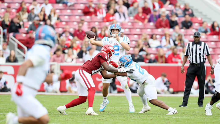 Nov 2, 2024; Fayetteville, Arkansas, USA; Ole Miss Rebels quarterback Jaxson Dart (2) passes to wide receiver Jordan Watkins (11) for a touchdown in the fourth quarter against the Arkansas Razorbacks at Donald W. Reynolds Razorback Stadium. Mississippi won 63-31. Mandatory Credit: Nelson Chenault-Imagn Images