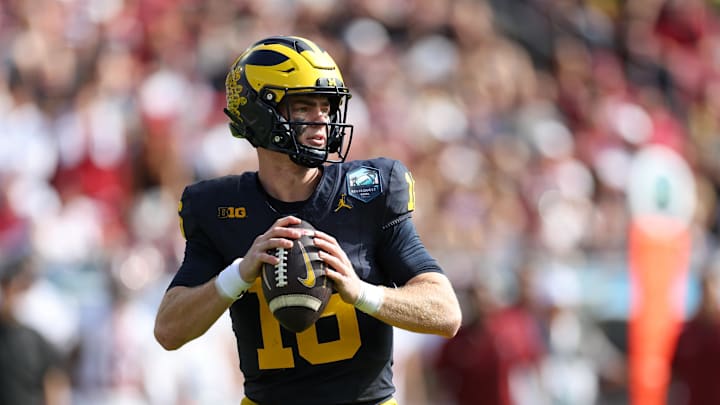 Dec 31, 2024; Tampa, FL, USA; Michigan Wolverines quarterback Davis Warren (16) drops back to pass against the Alabama Crimson Tide in the second quarter during the ReliaQuest Bowl at Raymond James Stadium. Mandatory Credit: Nathan Ray Seebeck-Imagn Images Dec 31, 2024; Tampa, FL, USA; Michigan Wolverines quarterback Davis Warren (16) drops back to pass against the Alabama Crimson Tide in the second quarter during the ReliaQuest Bowl at Raymond James Stadium. Mandatory Credit: Nathan Ray Seebeck-Imagn Images