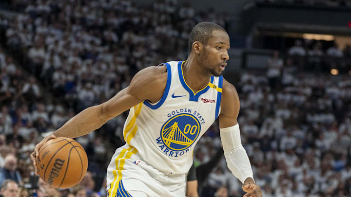 May 8, 2025; Minneapolis, Minnesota, USA; Golden State Warriors forward Jonathan Kuminga (00) dribbles the ball against the Minnesota Timberwolves in the second half during game two of the second round for the 2025 NBA Playoffs at Target Center. Mandatory Credit: Jesse Johnson-Imagn Images