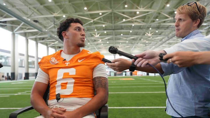 Knox News reporter Adam Sparks speaks to Tennessee quarterback Joey Aguilar (6) during football media day, in Knoxville, Tennessee, July 29, 2025.