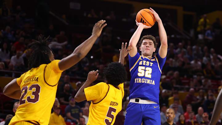 Jan 21, 2026; Tempe, Arizona, USA; West Virginia Mountaineers forward Treysen Eaglestaff (52) against the Arizona State Sun Devils in the first half at Desert Financial Arena. Mandatory Credit: Mark J. Rebilas-Imagn Images