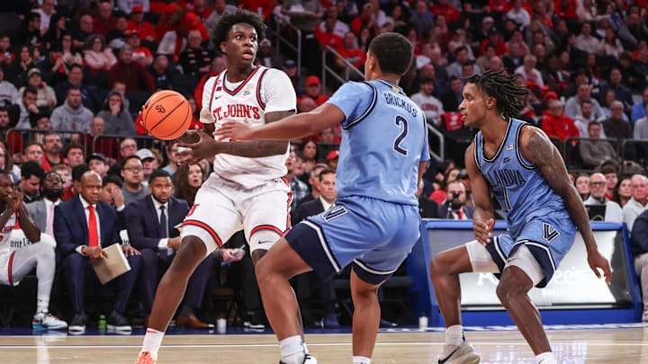 Jan 11, 2025; New York, New York, USA;  St. John's basketball guard Kadary Richmond (1) controls the ball against Villanova Wildcats guard Jhamir Brickus (2) in the second half at Madison Square Garden.