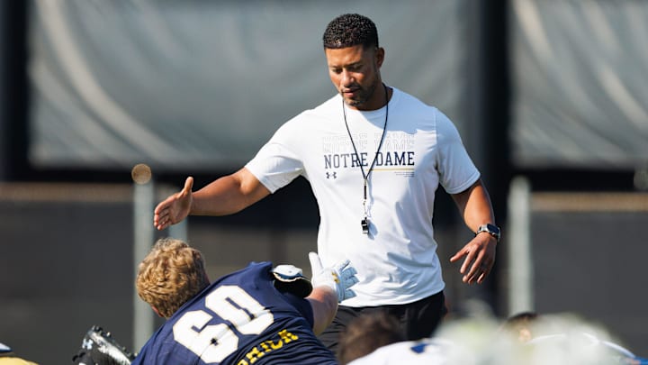 Notre Dame head coach Marcus Freeman greets offensive lineman Max Anderson (60) during a football practice at Irish Athletic Center on Sunday, Aug. 10, 2025, in South Bend.