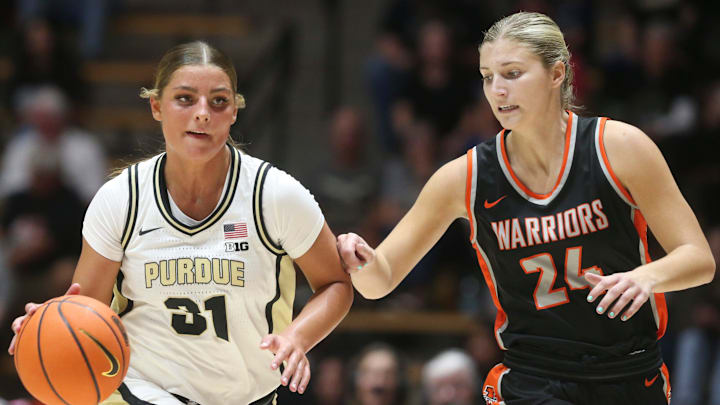 Purdue Boilermakers guard Sophie Swanson (31) drives past Indiana Tech Warriors forward Ava Ziolkowski (24)