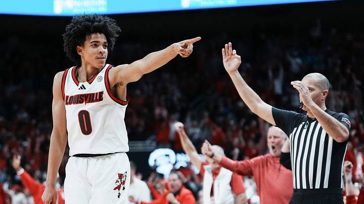 Louisville Cardinals guard Mikel Brown Jr. (0) celebrates his three-point shot as the Cards go up over Kentucky in the first half during the UofL-UK annual rivalry game at the KFC Yum! Center in Louisville, Kentucky Nov. 11, 2025. Louisville Cardinals guard Mikel Brown Jr. (0) celebrates his three-point shot as the Cards go up over Kentucky in the first half during the UofL-UK annual rivalry game at the KFC Yum! Center in Louisville, Kentucky Nov. 11, 2025.