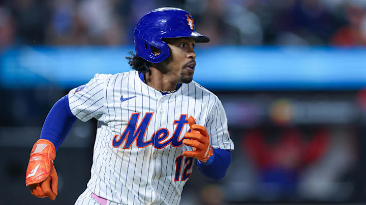 Aug 27, 2025; New York City, New York, USA; New York Mets shortstop Francisco Lindor (12) singles during the fifth inning against the Philadelphia Phillies at Citi Field.