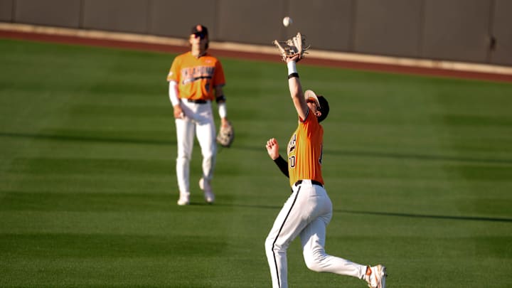 Oklahoma State outfielder Nolan Schubart (10) catches the ball for an out in the third inning of a college Bedlam baseball game between the University of Oklahoma Sooners (OU) and the Oklahoma State University Cowboys (OSU) at O'Brate Stadium in Stillwater, Okla., Tuesday, April 15, 2025.