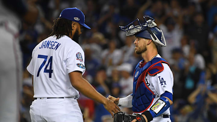 Oct 5, 2018; Los Angeles, CA, USA; Los Angeles Dodgers relief pitcher Kenley Jansen (74) celebrates with Los Angeles Dodgers catcher Yasmani Grandal (9) after defeating the Atlanta Braves in game two of the 2018 NLDS playoff baseball series at Dodger Stadium. Mandatory Credit: Jayne Kamin-Oncea-Imagn Images