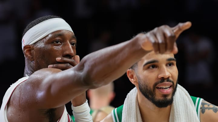 Apr 1, 2026; Miami, Florida, USA; Miami Heat center Bam Adebayo (13) signals while speaking to Boston Celtics forward Jayson Tatum (0) after the game at Kaseya Center. Mandatory Credit: Sam Navarro-Imagn Images