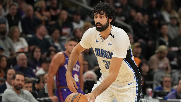 Nov 18, 2024; Phoenix, Arizona, USA; Orlando Magic center Goga Bitadze (35) drives against the Phoenix Suns during the second half of an NBA game at Footprint Center. Mandatory Credit: Rick Scuteri-Imagn Images Nov 18, 2024; Phoenix, Arizona, USA; Orlando Magic center Goga Bitadze (35) drives against the Phoenix Suns during the second half of an NBA game at Footprint Center. Mandatory Credit: Rick Scuteri-Imagn Images