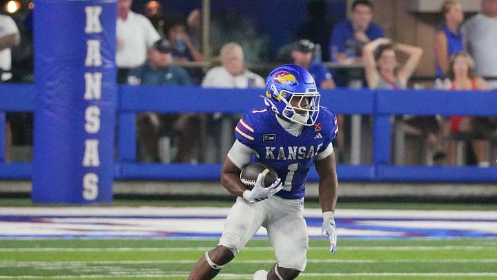 Sep 4, 2026; Lawrence, Kansas, USA; Kansas Jayhawks running back Dylan Edwards (1) runs the ball against the LIU Sharks during the first half at David Booth Kansas Memorial Stadium. Mandatory Credit: Denny Medley-Imagn Images Sep 4, 2026; Lawrence, Kansas, USA; Kansas Jayhawks running back Dylan Edwards (1) runs the ball against the LIU Sharks during the first half at David Booth Kansas Memorial Stadium. Mandatory Credit: Denny Medley-Imagn Images