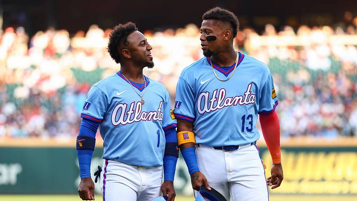 Aug 15, 2026; Cumberland, Georgia, USA; Atlanta Braves second baseman Ozzie Albies (1) and right fielder Ronald Acuña Jr. (13) react before a game against the Arizona Diamondbacks at Truist Park. Mandatory Credit: Colin Hubbard-Imagn Images