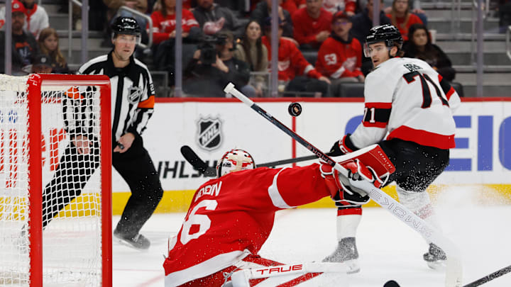 Mar 24, 2026; Detroit, Michigan, USA;  Detroit Red Wings goaltender John Gibson (36) os on Ottawa Senators center Ridly Greig (71) in the first period at Little Caesars Arena. Mandatory Credit: Rick Osentoski-Imagn Images
