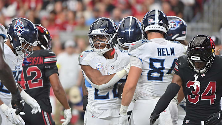 Oct 5, 2025; Glendale, Arizona, USA; Tennessee Titans running back Tony Pollard (20) reacts after a short touchdown run during the fourth quarter against the Arizona Cardinals at State Farm Stadium. Mandatory Credit: Matt Kartozian-Imagn Images
