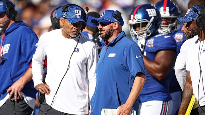 Oct 20, 2024; East Rutherford, New Jersey, USA; New York Giants head coach Brian Daboll, left, talks with assistant coach Jerome Henderson during the second half against the Philadelphia Eagles at MetLife Stadium.  