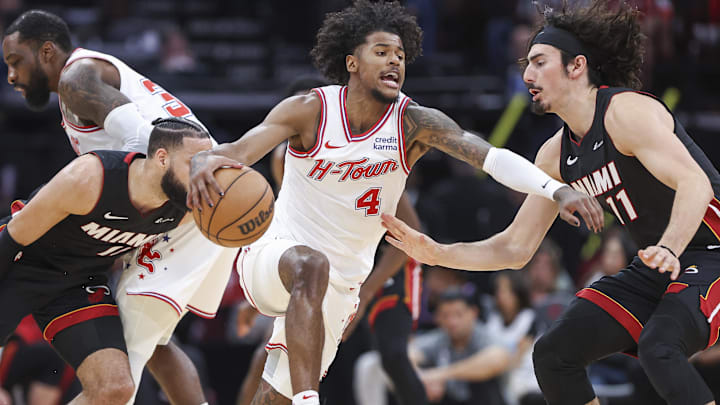 Apr 5, 2024; Houston, Texas, USA; Houston Rockets guard Jalen Green (4) dribbles the ball as Miami Heat guard Jaime Jaquez Jr. (11) defends during the fourth quarter at Toyota Center. Mandatory Credit: Troy Taormina-Imagn Images