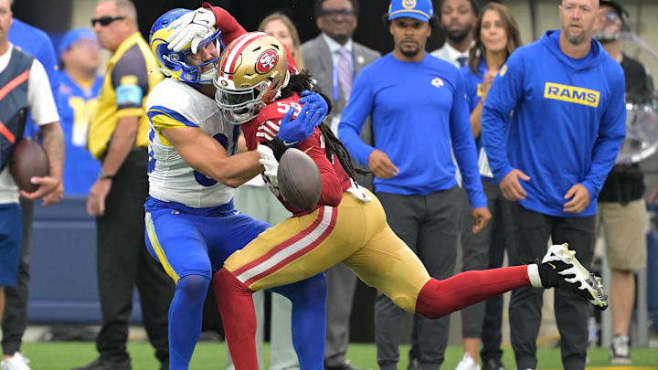 Sep 22, 2024; Inglewood, California, USA;  San Francisco 49ers linebacker De'Vondre Campbell (59) fouls Los Angeles Rams tight end Tyler Higbee (89) in the fourth quarter at SoFi Stadium. Mandatory Credit: Jayne Kamin-Oncea-Imagn Images