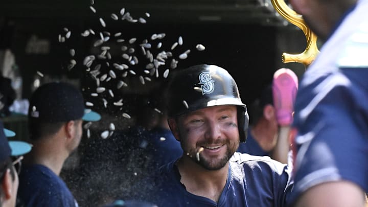 Seattle Mariners catcher Cal Raleigh (29) celebrates in the dugout after hitting a two run home run against the Chicago Cubs during the seventh inning at Wrigley Field on June 20.