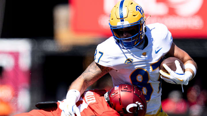 Cincinnati Bearcats' Mehki Miller (20) tackles Pittsburgh Panthers tight end Jake Overman (87) in the fourth quarter of the College Football game at Nippert Stadium in Cincinnati on Saturday, Sept. 7, 2024.
