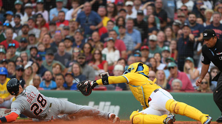 Sep 27, 2025; Boston, Massachusetts, USA; Detroit Tigers short stop Javier Baez (28) safely slides past the tag of Boston Red Sox catcher Carlos Narvaez (75) during the fifth inning at Fenway Park. Mandatory Credit: Bob DeChiara-Imagn Images Sep 27, 2025; Boston, Massachusetts, USA; Detroit Tigers short stop Javier Baez (28) safely slides past the tag of Boston Red Sox catcher Carlos Narvaez (75) during the fifth inning at Fenway Park. Mandatory Credit: Bob DeChiara-Imagn Images