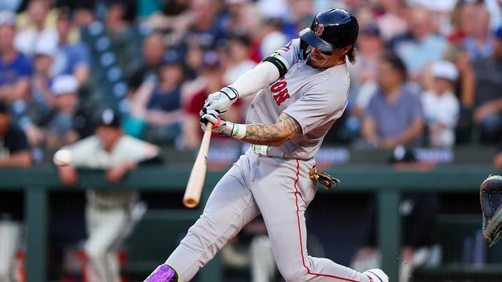 Jun 19, 2026; Seattle, Washington, USA;  Boston Red Sox outfielder Jarren Duran (16) hits a single in the sixth inning against the Seattle Mariners at T-Mobile Park. Mandatory Credit: Kevin Ng-Imagn Images