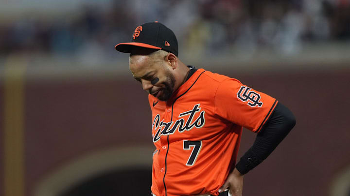 Sep 12, 2025; San Francisco, California, USA; San Francisco Giants first baseman Dominic Smith (7) walks off of the field after suffering an injury during the fourth inning against the Los Angeles Dodgers at Oracle Park. Mandatory Credit: Darren Yamashita-Imagn Images