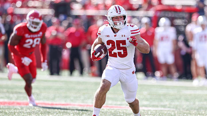 Oct 12, 2024; Piscataway, New Jersey, USA; Wisconsin Badgers running back Cade Yacamelli (25) gains yards after catch during the second half against the Rutgers Scarlet Knights at SHI Stadium.
