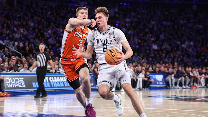 Feb 22, 2025; New York, NY, USA;  Duke Blue Devils guard Cooper Flagg (2) drives past Illinois Fighting Illini forward Ben Humrichous (3) in the first half at Madison Square Garden. Mandatory Credit: Wendell Cruz-Imagn Images