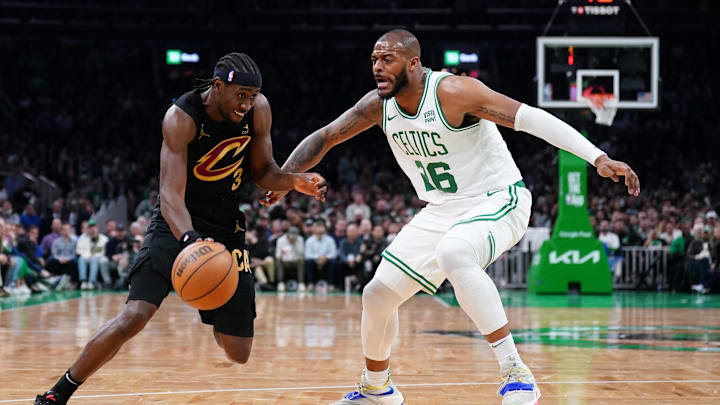 May 9, 2024; Boston, Massachusetts, USA; Cleveland Cavaliers guard Caris LeVert (3) drives the ball against Boston Celtics center Xavier Tillman Sr.