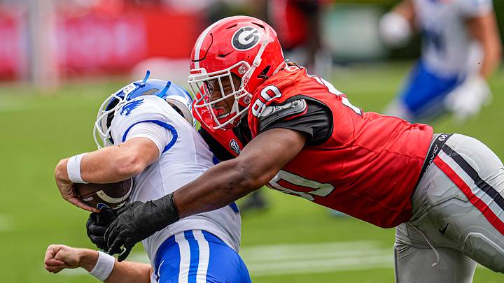 Oct 4, 2025; Athens, Georgia, USA; Georgia Bulldogs defensive lineman Elijah Griffin (90) chases and tackles Kentucky Wildcats quarterback Cutter Boley (8) at Sanford Stadium. Mandatory Credit: Dale Zanine-Imagn Images Oct 4, 2025; Athens, Georgia, USA; Georgia Bulldogs defensive lineman Elijah Griffin (90) chases and tackles Kentucky Wildcats quarterback Cutter Boley (8) at Sanford Stadium. Mandatory Credit: Dale Zanine-Imagn Images