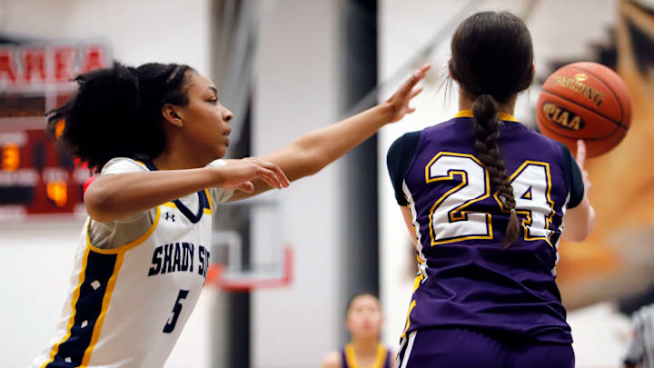 Shady Side Academy guard Cameron Capel attempts to knock away a pass from Our Lady of the Sacred Heart's Lola Garner during the third quarter of a PIAA Class 3A semifinal Friday night at Fox Chapel High School. Capel scored five points in the Bulldogs' 43-29 win.