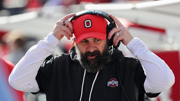 Nov 22, 2025; Columbus, Ohio, USA; Ohio State Buckeyes defensive coordinator Matt Patricia puts on his headset before the game against the Rutgers Scarlet Knights at Ohio Stadium. Mandatory Credit: Joseph Maiorana-Imagn Images Nov 22, 2025; Columbus, Ohio, USA; Ohio State Buckeyes defensive coordinator Matt Patricia puts on his headset before the game against the Rutgers Scarlet Knights at Ohio Stadium. Mandatory Credit: Joseph Maiorana-Imagn Images