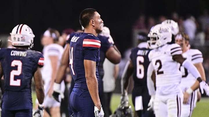 Sep 9, 2023; Starkville, Mississippi, USA; Arizona Wildcats wide receiver Tetairoa McMillan (4) reacts after losing in overtime to the Mississippi State Bulldogs at Davis Wade Stadium at Scott Field. Mandatory Credit: Matt Bush-Imagn Images