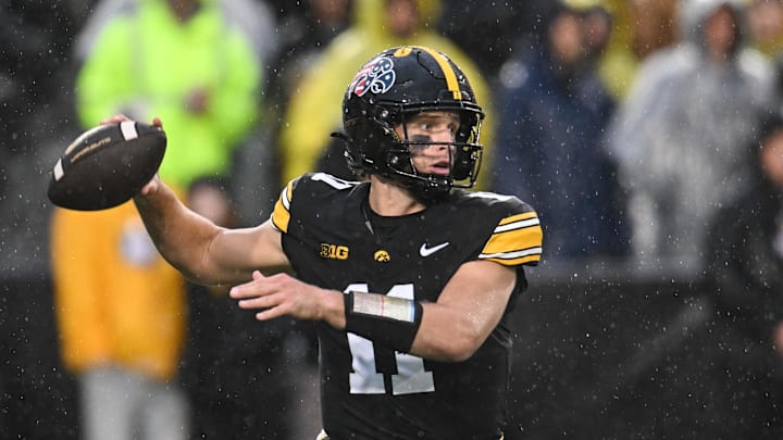 Nov 8, 2025; Iowa City, Iowa, USA; Iowa Hawkeyes quarterback Mark Gronowski (11) throws a pass against the Oregon Ducks during the first quarter at Kinnick Stadium. Mandatory Credit: Jeffrey Becker-Imagn Images