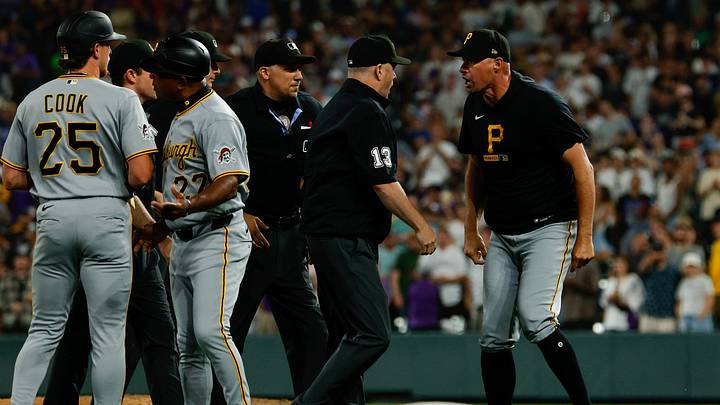Jun 20, 2026; Denver, Colorado, USA; Pittsburgh Pirates manager Don Kelly (12) argues a play with first base umpire Todd Tichenor (13) after the game against the Colorado Rockies at Coors Field. Mandatory Credit: Isaiah J. Downing-Imagn Images