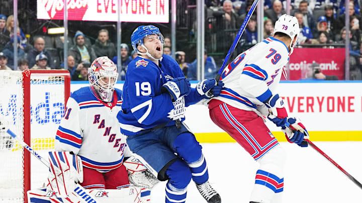 Dec 19, 2023; Toronto, Ontario, CAN; Toronto Maple Leafs center Calle Jarnkrok (19) gets hit with