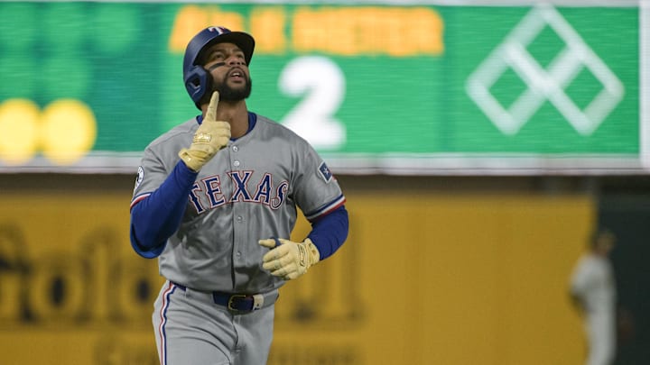 Texas Rangers outfielder Leody Taveras (3) points to the sky after hitting a home run