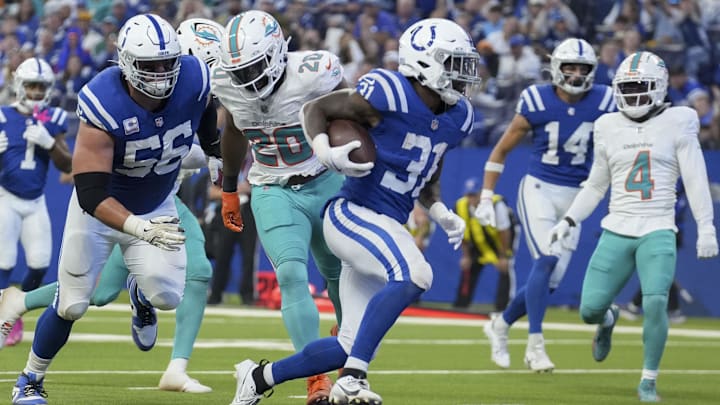 Indianapolis Colts running back Tyler Goodson (31) rushes into the end zone for his first career touchdown during a game against the Miami Dolphins at Lucas Oil Stadium .