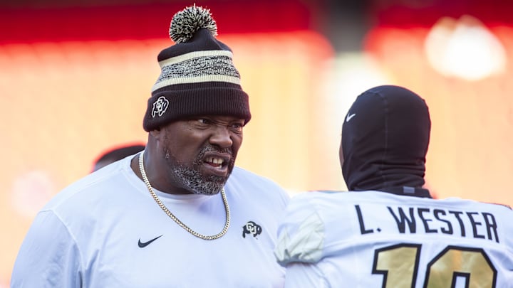 Nov 23, 2024; Kansas City, Missouri, USA; Colorado coach Warren Sapp motivates Colorado wide receiver LaJohntay Wester (10) prior to the game between the Kansas Jayhawks and the Colorado Buffaloes at GEHA Field at Arrowhead Stadium. Mandatory Credit: Nick Tre. Smith-Imagn Images Nov 23, 2024; Kansas City, Missouri, USA; Colorado coach Warren Sapp motivates Colorado wide receiver LaJohntay Wester (10) prior to the game between the Kansas Jayhawks and the Colorado Buffaloes at GEHA Field at Arrowhead Stadium. Mandatory Credit: Nick Tre. Smith-Imagn Images